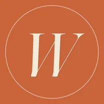 Wren’s mark: an italic W on a terracotta circle.